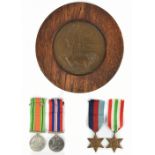 A WWII four piece medal group comprising the 1939-1945 star, the Italy star, the Defence Medal and