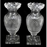 A pair of 19th century hobnail cut pedestal glass vases, raised on square plinth bases, height