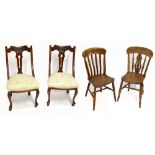 A pair of Edwardian mahogany salon chairs with padded stuff-over seats on cabriole front legs, and a