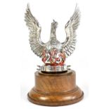 A hallmarked silver car mascot modelled as a phoenix, commemorating 25 years from 1935 - 1960,