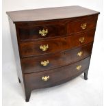 An early 19th century mahogany bowfront chest of two short and three long drawers, raised on splayed