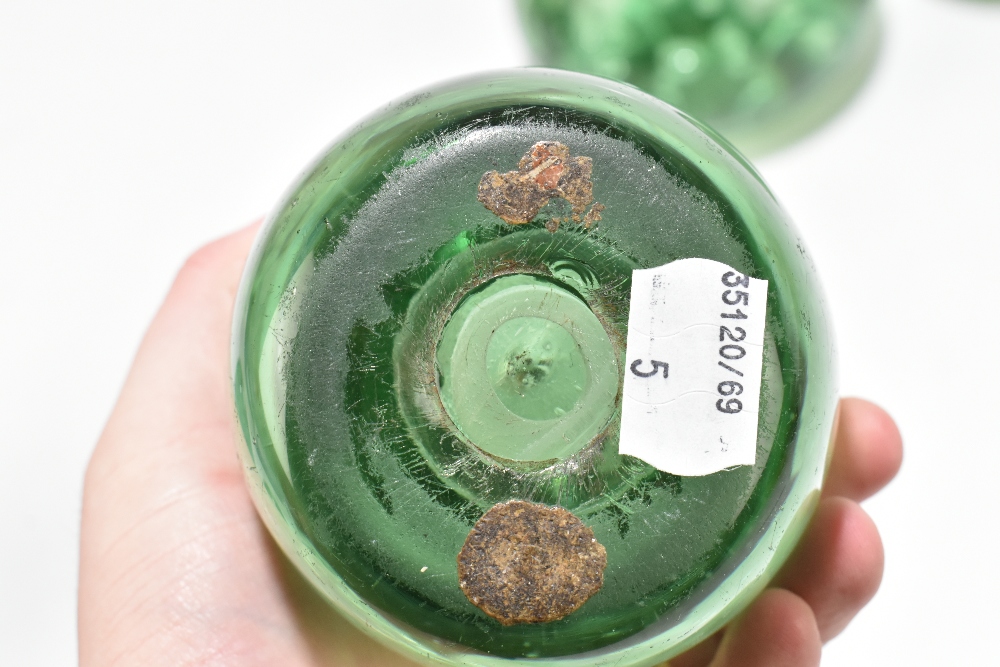 Five Victorian green glass dump weights comprising three examples with internal bubbles and two with - Image 5 of 7