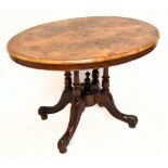 A Victorian burr walnut oval loo table, with four turned column supports, on carved outswept legs,