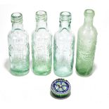 Four glass advertising bottles, three for N.P Sandiford & Sons Ltd, Manchester, a cider bottle for