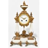 A late 19th century gilt spelter and white marble eight day mantel clock with Arabic numerals to the