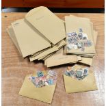 WORLD (incl. GB & Commonwealth) - assortment of stamps in c.100 brown envelopes sorted into