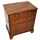 A 19th century mahogany chest of four long drawers of small proportions, the moulded top above brass