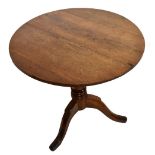 A late George III oak tilt-top occasional table. Additional InformationTop with old repairs at joins