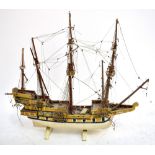 A wooden scratch-built model of a galleon, height 58cm (af).