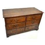 A 19th century oak blanket chest, the hinged lid above four dummy drawers and two base drawers on