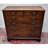 A George IV mahogany chest of two short and four long graduated drawers raised on bracket feet,