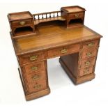 An Edwardian oak twin pedestal desk with galleried raised super structure, width 106cm.