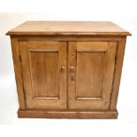 A pine two door side cabinet raised on a plinth base.Additional InformationHeight 78.5cm Width