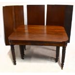 IN THE MANNER OF GILLOWS; an early 19th century mahogany extending dining table with ratchet brass