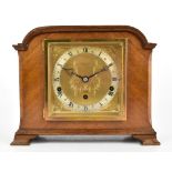 ELLIOT; a 1950s walnut cased chiming mantel clock, with gilt dial , with applied silvered chapter