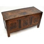 An early 18th century oak coffer with later carved detailing, on stile feet, height 68cm, width