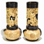 BRETBY; a pair of Oriental inspired relief decorated vases, height 37cm (one af).Additional