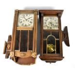 Two early 20th century wall clocks, each with silvered dials, with bevelled glass plate, height of