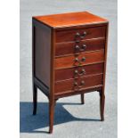 An Edwardian five drawer music cabinet and a pie crust occasional table (af) (2).