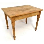 An early to mid-20th century small pine kitchen table with rounded rectangular top and ring turned