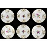 MEISSEN; a set of six Marcolini period plates, each with moulded and hand painted decoration of