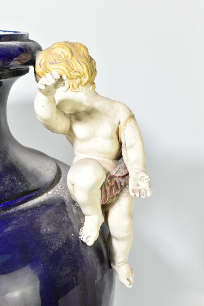 PARIS 1878; a very large blue glazed majolica twin handled vase set with cherubs beside the flared - Bild 3 aus 12