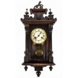 JUNGHANS; an early 20th century ebonised Vienna type wall clock with horse finial, the circular dial