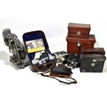 A collection of assorted cine cameras and projectors, including Bell & Howell 200EE, Bell & Howell