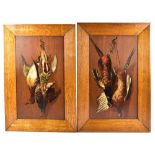 A pair of late 19th century oils and oak panels depicting dead game, in oak frames, 49 x 29cm (2).