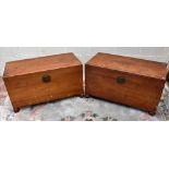 Two Chinese camphor wood chests, each with carved circular cabochon to the lid with a central