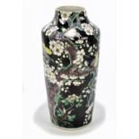 A 19th century Chinese Famille Noir vase painted with birds amongst branches bearing Chen Lun