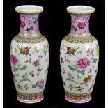 A pair of 20th century Chinese Famille Rose vases, painted with flowers and insects, seal mark to