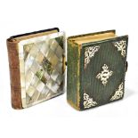 A Victorian photograph album with mother of pearl cover containing a selection of family