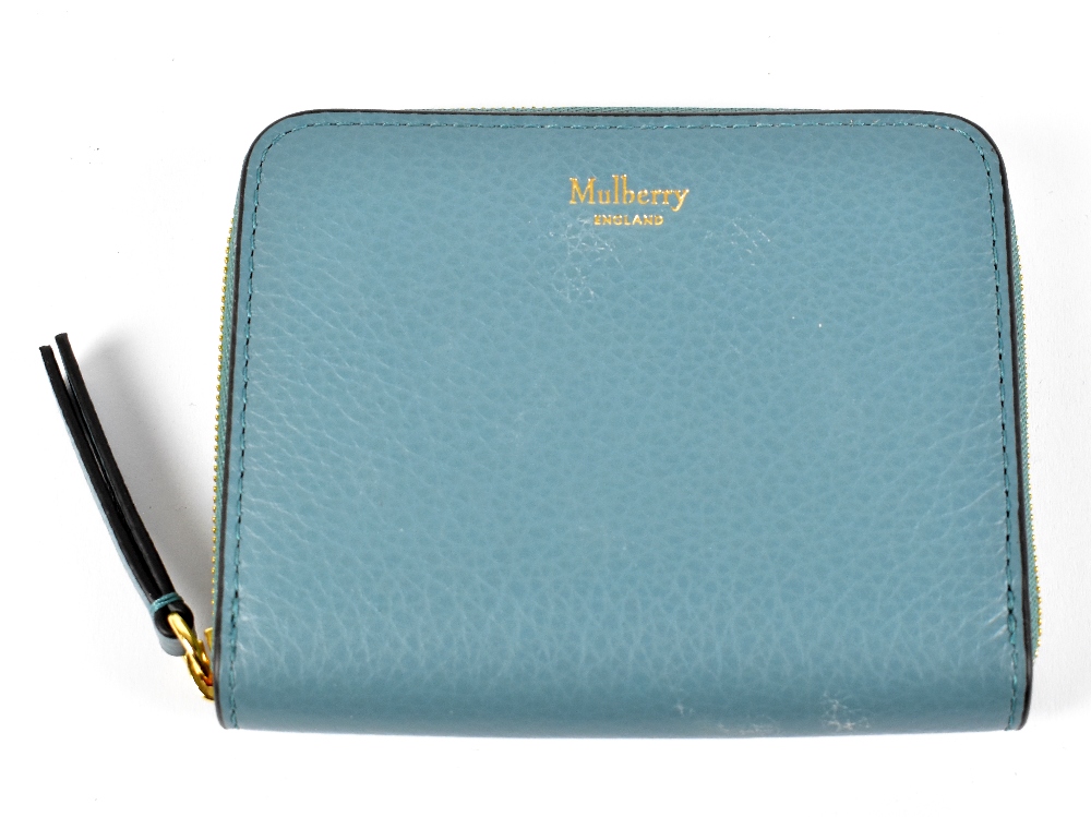 MULBERRY; a light blue pebbled calf leather zip top card case with gold tone zip and oxblood calf