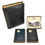A Victorian photograph album, together with a small collection of postcards and photographs, and two