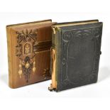 Two Victorian photograph albums including a brown leatherette example with gilt floral tooling,