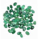 EMERALD; a group of oval 7 x 5mm stones totalling 47.68ct.