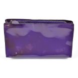 SMYTHSON; a purple patent leather make up bag with a silver tone top zip, with embossed logo to