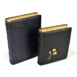 Two late 19th/early 20th century photograph albums, the larger example enclosing a selection of