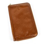 LOUIS VUITTON; a gold brown Vernis enamel patent leather zip around long purse/wallet with gold tone