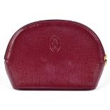 CARTIER; a Must de Cartier burgundy embossed leather make up bag with gold plated embossed logo