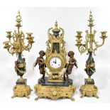 FRANZ HERMLE; a reproduction gilt metal and green marble effect clock garniture, the elaborate clock