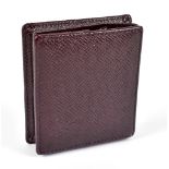 LOUIS VUITTON; a Taiga cowhide embossed leather akajou red/brown coin purse with calfskin