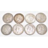 A collection of eight half silver crowns comprising 1935, 1931, 1935, 1932, 1930, 1929, 1928, and