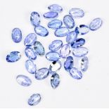 TANZANITE; thirty 6 x 4mm oval facet cut stones.