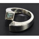 GUCCI; a silver and blue gemstone twirl ring with 'Gucci' embossed to one side, stamped '925 Gucci