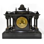 A Victorian French black slate mantel clock with circular dial set with Arabic numerals, width
