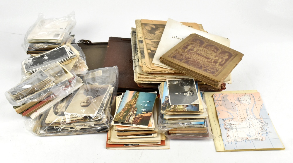 A quantity of ephemera including mid to late 20th century postcards, two personal photograph albums,