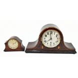 An Edwardian mahogany chevron strung Napoleon hat mantel clock with Arabic numerals to the dial,