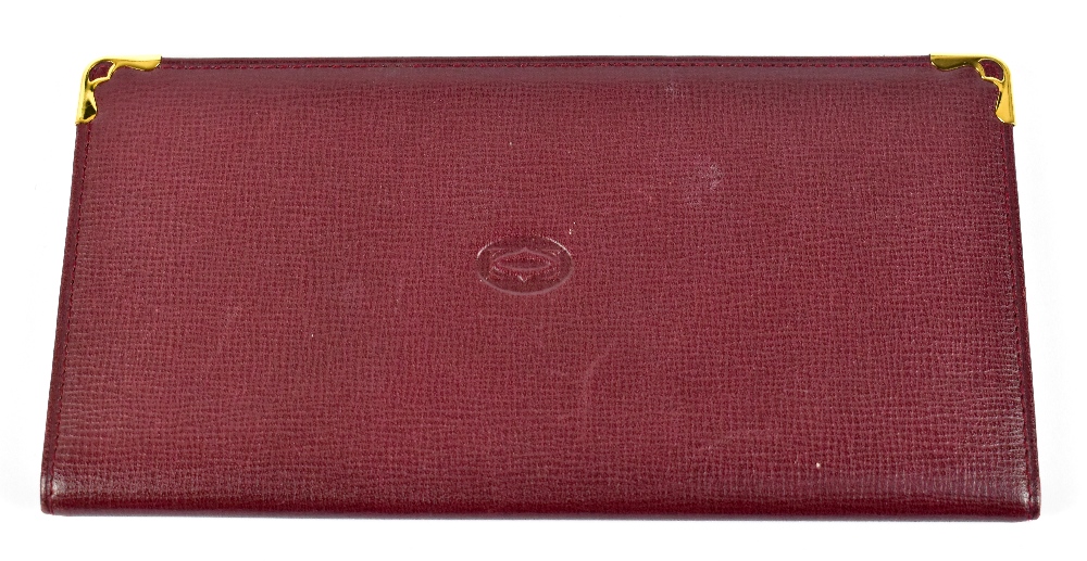 CARTIER; an unused Must de Cartier calfskin leather card holder/wallet, with slots for seven cards